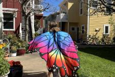 The daughter of author Courtney E. Martin wanders through their cohousing community in a butterfly costume.